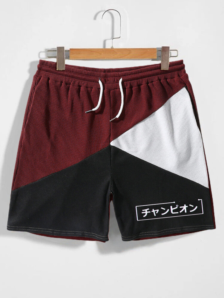 Pantalones cortos de punto de gofre bordado japonés de patchwork de bloque de color para hombre