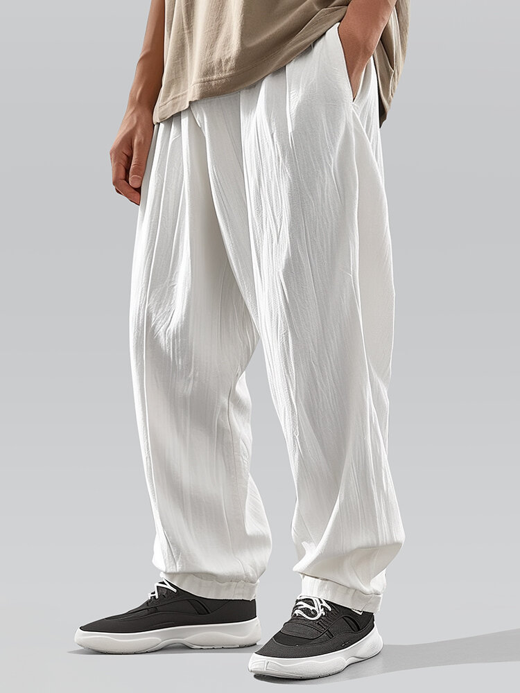 Pantalon décontracté à texture de couleur unie pour hommes avec poche