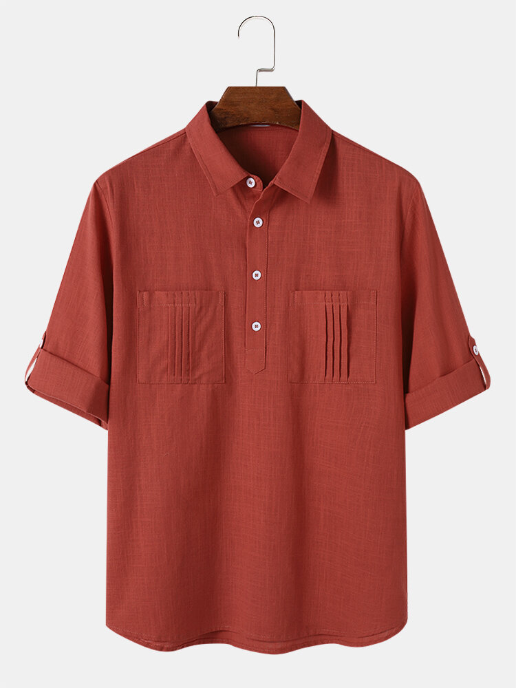 Camisas henley de manga enrollable de algodón con doble bolsillo plisado liso para hombre