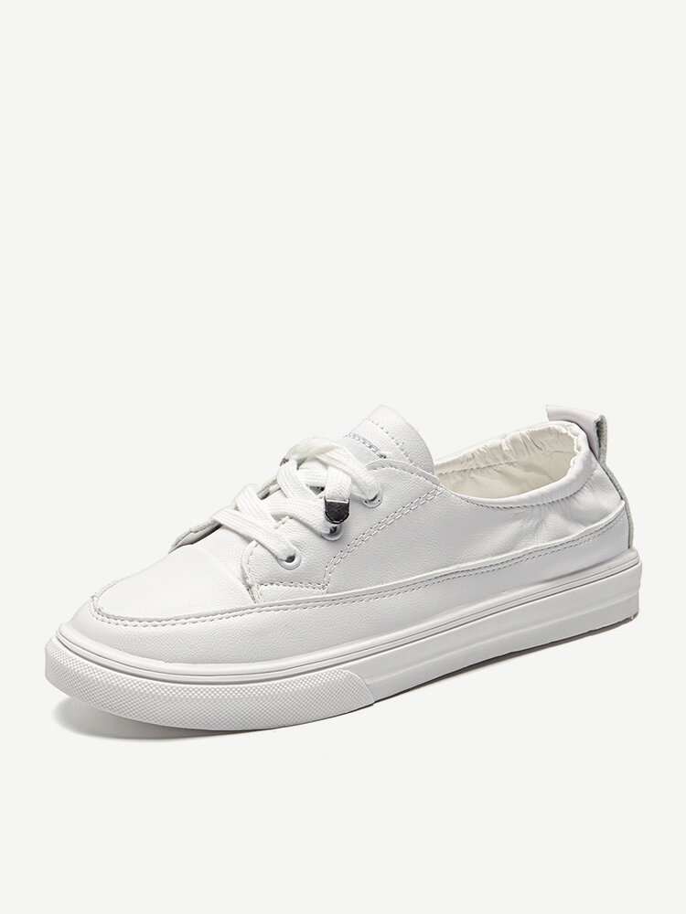 white flat sneakers