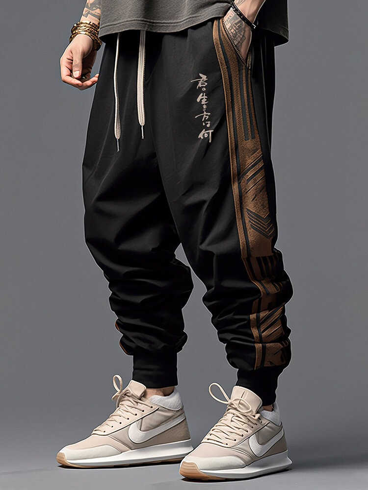 Cintura con cordón y retales de rayas laterales japonesas para hombre suelta Pantalones