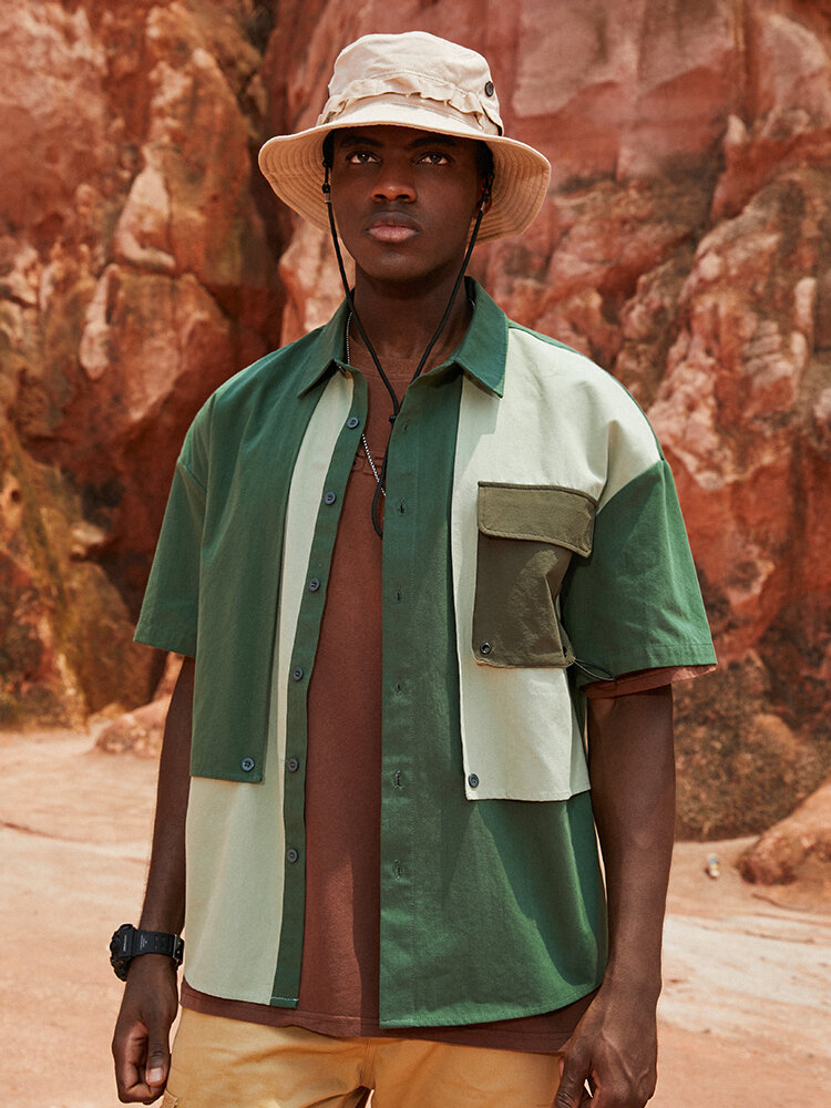 Camisas de hombros caídos de algodón con bolsillo con solapa de retazos de bloque de color para hombre