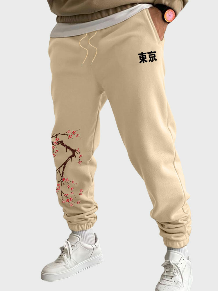 Pantalones deportivos holgados con cordón en la cintura con estampado de flores de cerezo japonés para hombre