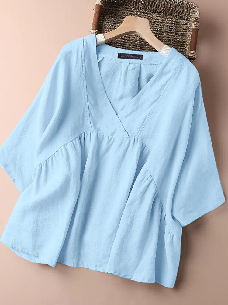 Blusa suelta de algodón con cuello en V y detalle de costuras lisas para mujer