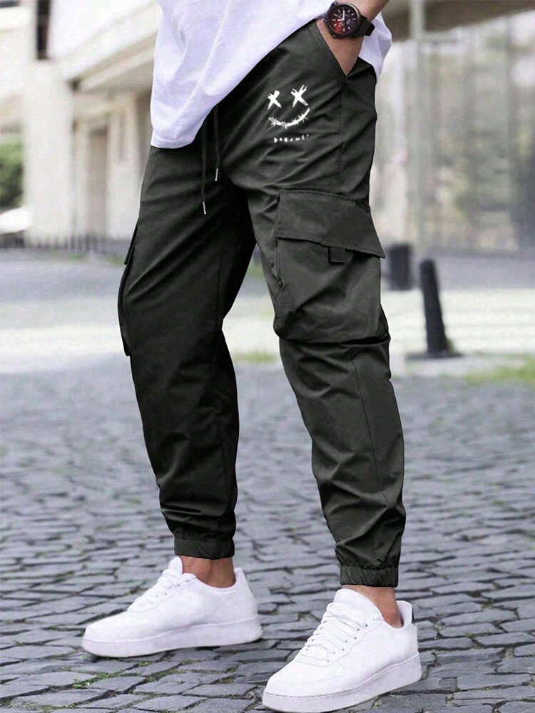 Pantalon cargo à taille avec cordon de serrage et poche imprimée sourire pour hommes