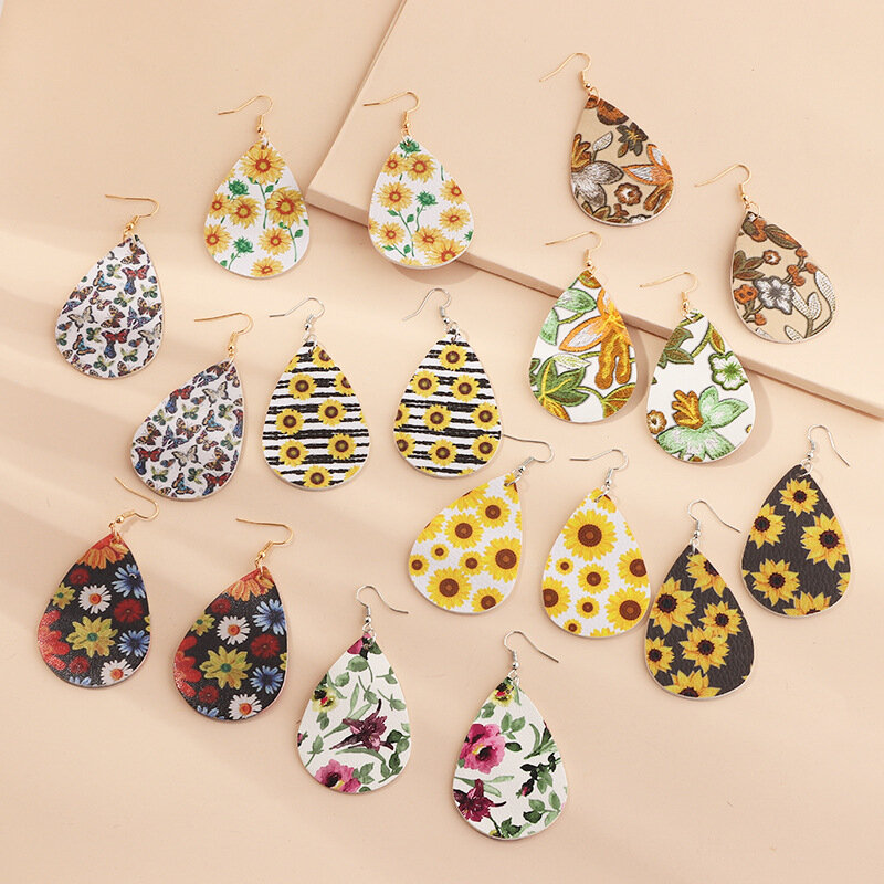 

Trendy Daisy Sunflower Flower Butterfly Water Drop Earrings Lychee Printed Leather Earrings
