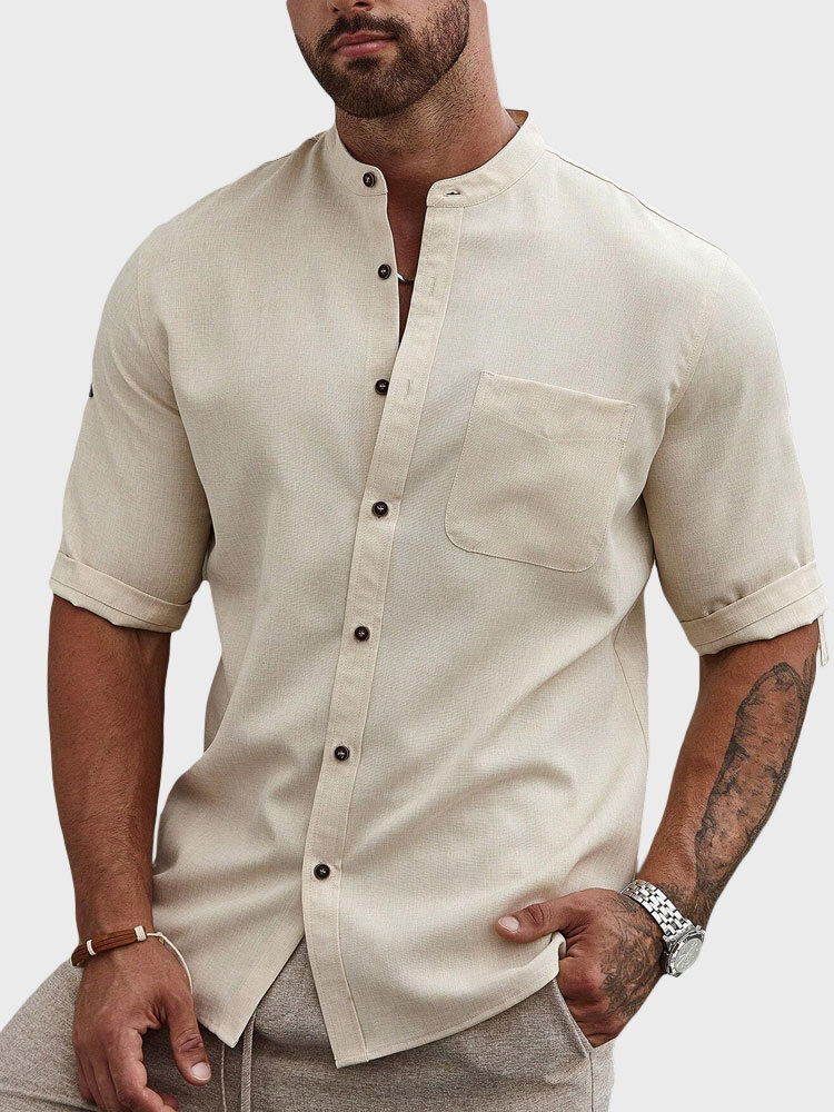 Camisas casuales de manga corta con bolsillo en el pecho y cuello alto sólido para hombre