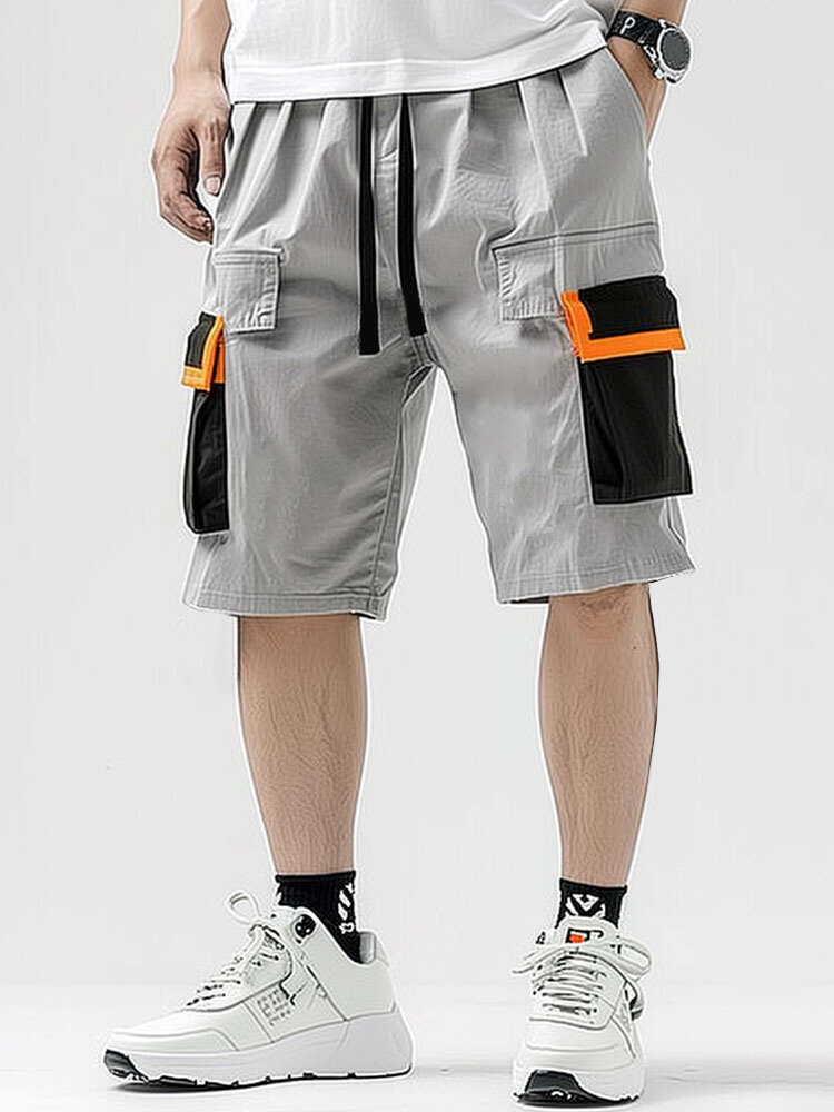 Shorts masculinos sólidos patchwork com aba e bolso com cordão