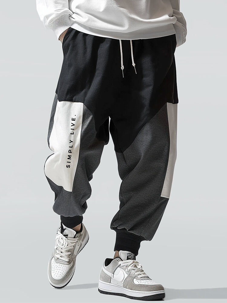 Pantalon décontracté à taille avec cordon de serrage pour homme avec slogan imprimé et bloc de couleurs