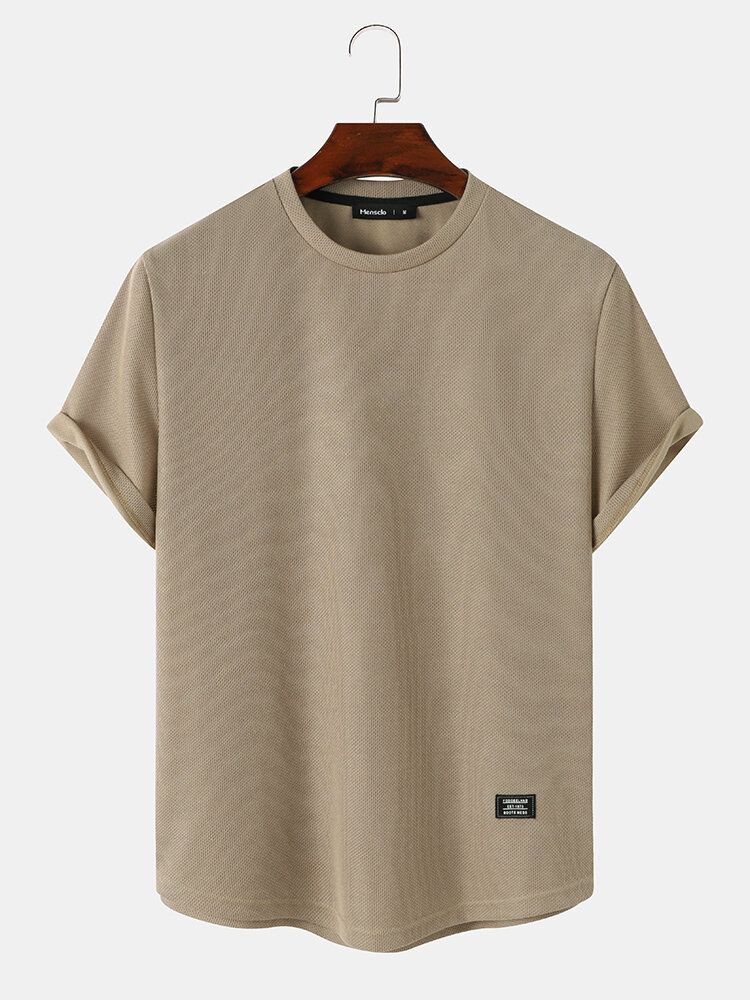 Camisetas de manga corta de punto con apliques de color liso para hombre Cuello