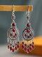 Vintage Bohemian Carved Hollow Round-shaped With Leaf-shaped Tassel Alloy Earrings - Red