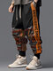 पुरुषों की जातीय जनजातीय टोटेम प्रिंट पैचवर्क ढीली ड्रॉस्ट्रिंग कमर पैंट - काली