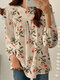 Damen-Bluse mit Blumen- und Pflanzendruck, Rundhalsausschnitt und langen Ärmeln - Aprikose