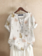 Damen-Bluse mit Blumen- und Pflanzendruck, Rundhalsausschnitt und halben Knöpfen - Weiß