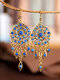 Boucles d'oreilles à pendentif pompon à fleurs creuses vintage - Bleu
