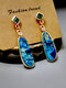 Boucles d'oreilles longues en pierre marine vintage Boucles d'oreilles pendantes en opale synthétique - Or