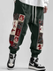 पुरुषों की विंटेज फ्लोरल प्रिंट पैचवर्क लूज़ ड्रॉस्ट्रिंग कमर पैंट - हरा