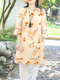 Lang geschnittene Bluse mit seitlichem Schlitz und 3/4-Ärmeln für Damen mit floralem Pflanzendruck - Aprikose