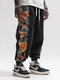 Cintura holgada con cordón y patchwork con estampado lateral floral para hombre Pantalones - Negro