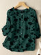 Blusa feminina manga 3/4 com estampa floral e detalhe de botões no decote - Verde escuro