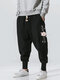 पुरुषों की जापानी चेरी ब्लॉसम प्रिंट 100% कॉटन ड्रॉस्ट्रिंग कमर पैंट - काली