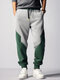 Pantalones deportivos holgados con cordón en la cintura y patchwork de dos tonos para hombre - gris