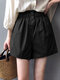 Shorts casuais de cintura elástica com botão de bolso sólido - Preto