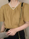 Einfarbige, kurzärmlige Bluse mit Rundhalsausschnitt und Falten am Rücken zum Binden - Khaki