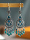 Vintage Bohemian Carved Hollow Round-shaped With Leaf-shaped Tassel Alloy Earrings - Peacock Blue