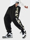 पुरुष पांडा साइड प्रिंट पैचवर्क कैज़ुअल ड्रॉस्ट्रिंग कमर पैंट शीतकालीन - काली