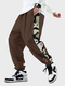 पुरुष पांडा साइड प्रिंट पैचवर्क कैज़ुअल ड्रॉस्ट्रिंग कमर पैंट शीतकालीन - भूरा