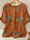Kurzärmlige Bluse mit Blumendruck und Rundhalsausschnitt - Orange
