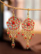 Boucles d'oreilles à pendentif pompon à fleurs creuses vintage - rouge